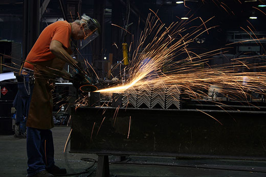 Employee Grinding Steel